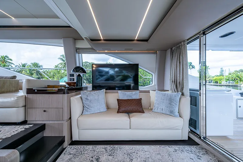 Evado Yacht Photos Pics Luxurious interior of 2020 Azimut 66 yacht with modern decor and large windows.