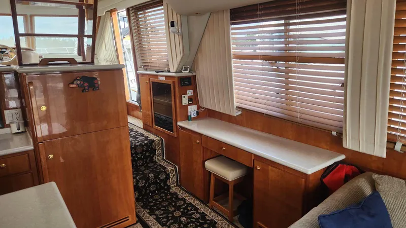  Yacht Photos Pics Interior of 2003 Navigator 4800 yacht with wooden cabinetry and blinds.