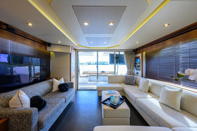 Catch The Wave Yacht Photos Pics Luxurious interior of 2014 Sunseeker Manhattan 73 yacht with elegant seating and modern decor.