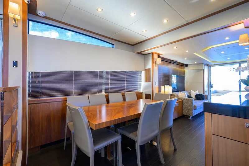 Catch The Wave Yacht Photos Pics Luxurious interior of 2014 Sunseeker Manhattan 73 yacht with elegant dining area.