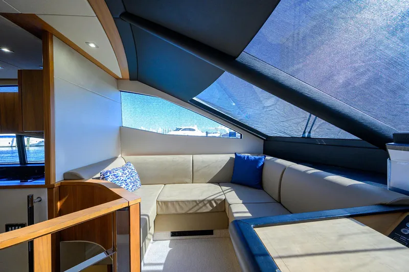 Catch The Wave Yacht Photos Pics Luxurious interior of 2014 Sunseeker Manhattan 73 yacht with plush seating and modern design.