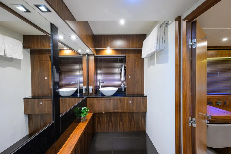 Catch The Wave Yacht Photos Pics Luxurious bathroom interior of 2014 Sunseeker Manhattan 73 yacht with modern fixtures.