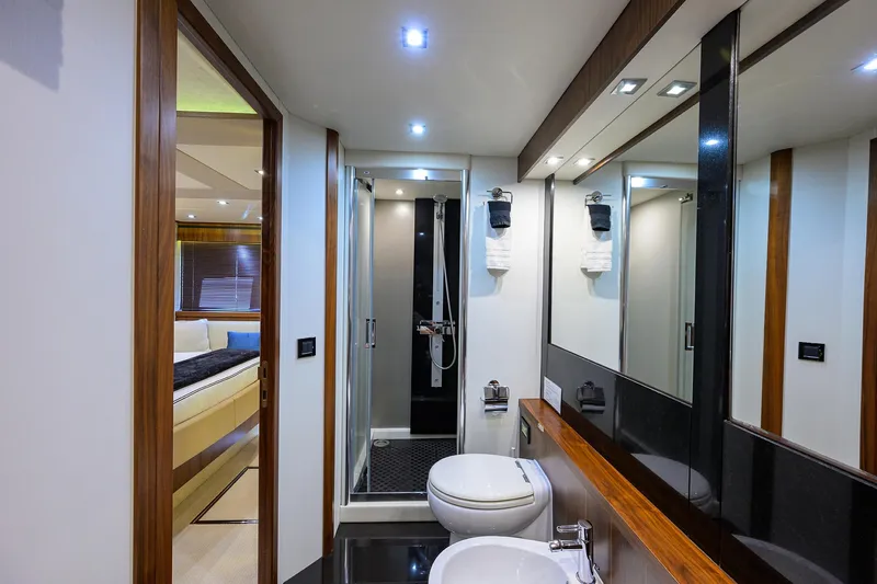 Catch The Wave Yacht Photos Pics Luxurious bathroom in 2014 Sunseeker Manhattan 73 yacht, featuring modern fixtures and elegant design.