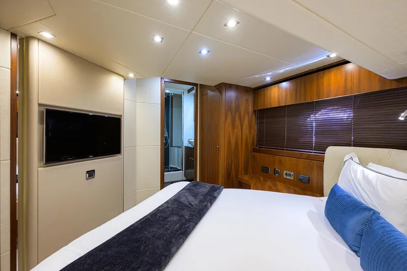 Catch The Wave Yacht Photos Pics Luxurious bedroom interior of 2014 Sunseeker Manhattan 73 yacht with modern amenities.