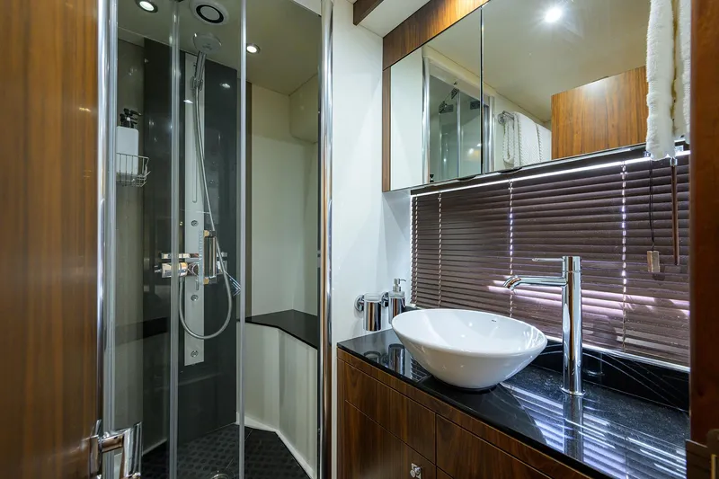 Catch The Wave Yacht Photos Pics Luxurious bathroom in 2014 Sunseeker Manhattan 73 yacht with modern fixtures and elegant design.