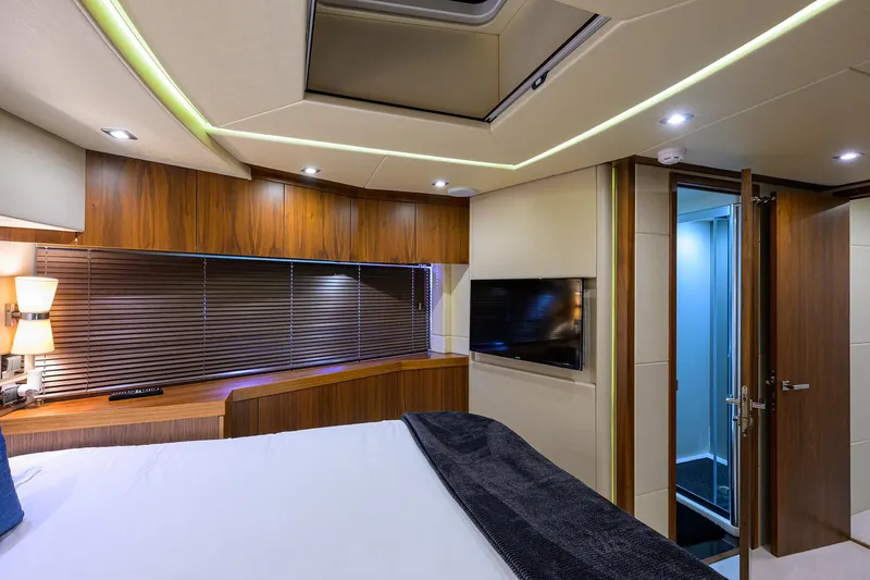 Catch The Wave Yacht Photos Pics Luxurious interior of 2014 Sunseeker Manhattan 73 yacht bedroom with modern design.