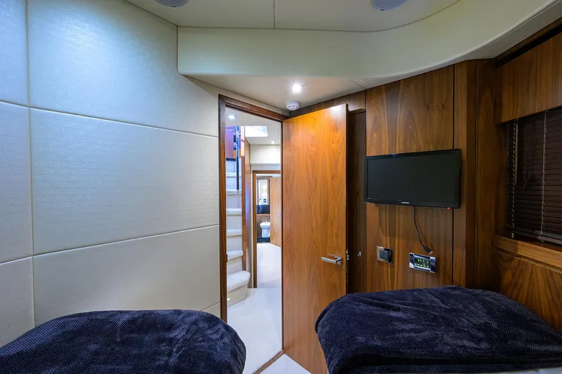 Catch The Wave Yacht Photos Pics Interior cabin of 2014 Sunseeker Manhattan 73 yacht with modern wood paneling.