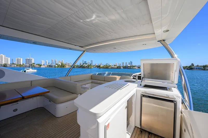 Catch The Wave Yacht Photos Pics Luxurious 2014 Sunseeker Manhattan 73 yacht deck with seating and ocean view.