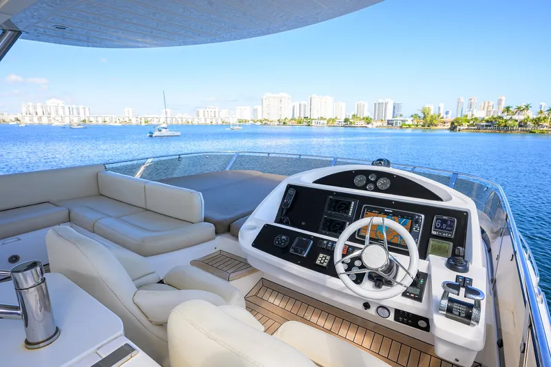 Catch The Wave Yacht Photos Pics Luxurious 2014 Sunseeker Manhattan 73 yacht interior with modern helm and waterfront view.