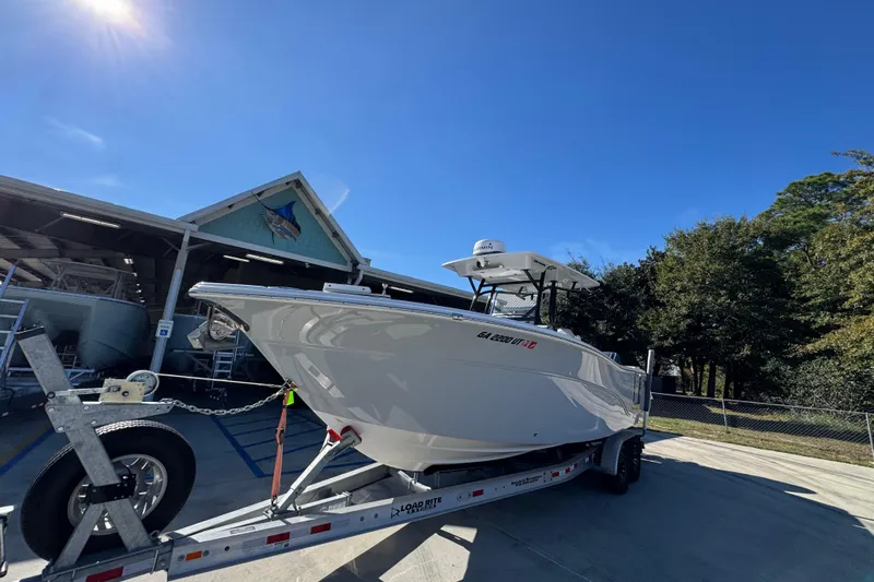  Yacht Photos Pics 2022 Sea Fox 288 Commander boat on trailer under clear blue sky.
