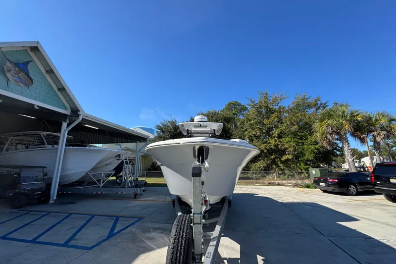  Yacht Photos Pics 2022 Sea Fox 288 Commander boat on trailer in sunny outdoor setting.