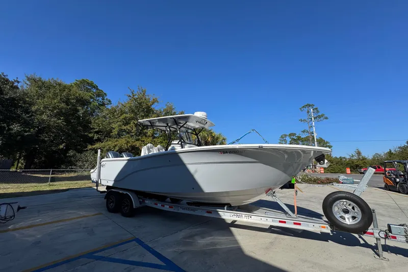  Yacht Photos Pics 2022 Sea Fox 288 Commander boat on trailer under clear blue sky.