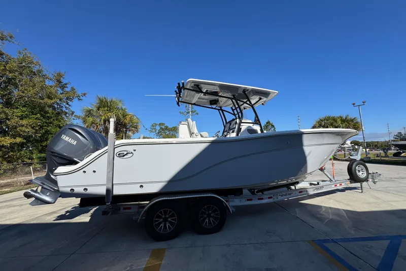  Yacht Photos Pics 2022 Sea Fox 288 Commander boat on trailer, featuring Yamaha engine, under clear blue sky.