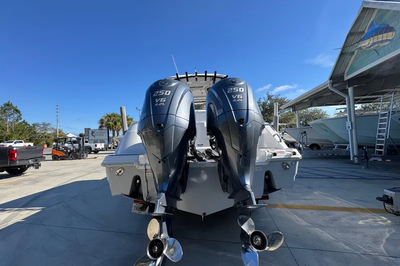  Yacht Photos Pics 2022 Sea Fox 288 Commander with dual 250 V6 outboard engines in a marina setting.