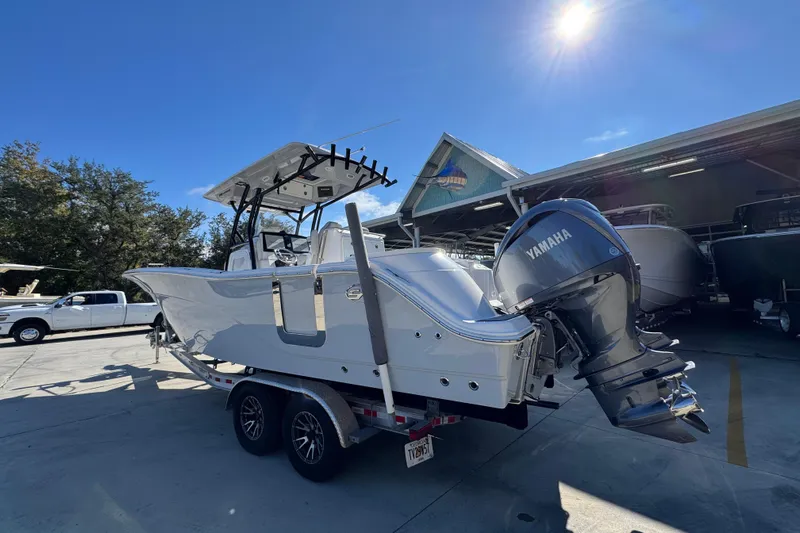  Yacht Photos Pics 2022 Sea Fox 288 Commander boat with Yamaha engine on trailer in sunny marina.