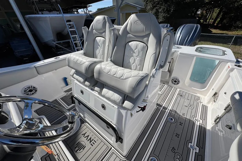  Yacht Photos Pics 2022 Sea Fox 288 Commander boat interior with dual captain's chairs and sleek design.