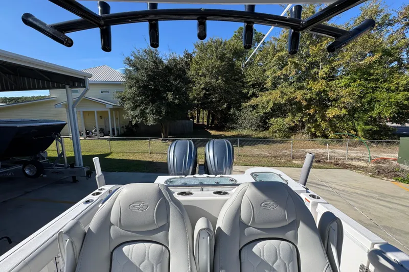 Yacht Photos Pics 2022 Sea Fox 288 Commander boat with dual engines, parked outdoors near trees and a house.