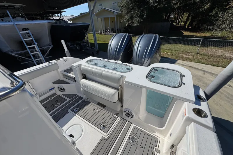  Yacht Photos Pics 2022 Sea Fox 288 Commander boat interior with dual engines and seating area.