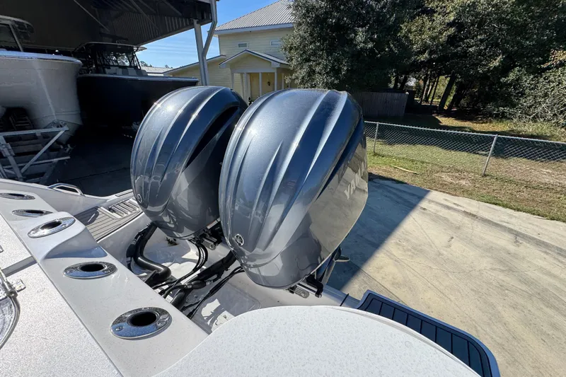  Yacht Photos Pics 2022 Sea Fox 288 Commander with dual outboard engines, parked outdoors.