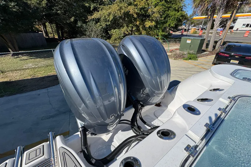  Yacht Photos Pics 2022 Sea Fox 288 Commander with dual outboard engines, parked outdoors.