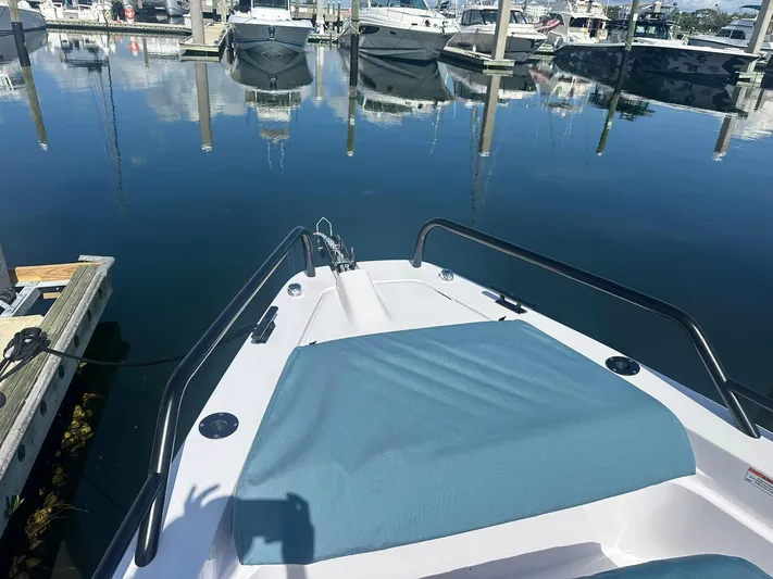 Empoleon Yacht Photos Pics 2025 Axopar 37XC CROSS CABIN BRABUS Trim docked at marina, calm water reflections.