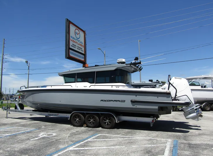 Empoleon Yacht Photos Pics 2025 Axopar 37XC CROSS CABIN BRABUS Trim boat on trailer at Nautical Ventures.