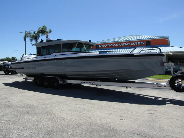 Empoleon Yacht Photos Pics 2025 Axopar 37XC CROSS CABIN BRABUS Trim on trailer at Nautical Ventures.