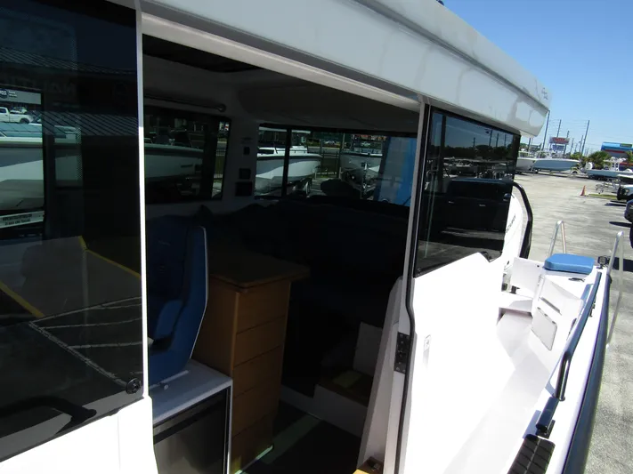 Empoleon Yacht Photos Pics 2025 Axopar 37XC CROSS CABIN BRABUS Trim interior view, showcasing seating and cabin features.