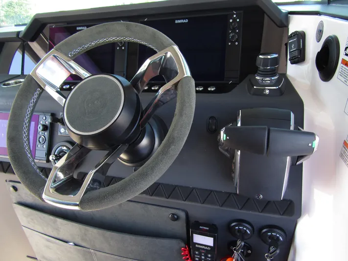 Empoleon Yacht Photos Pics 2025 Axopar 37XC CROSS CABIN BRABUS Trim steering wheel and control panel.