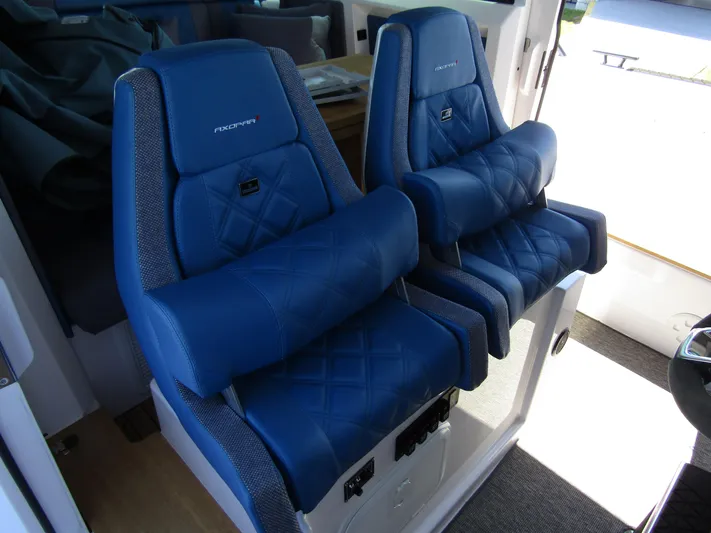 Empoleon Yacht Photos Pics 2025 Axopar 37XC CROSS CABIN BRABUS Trim with luxurious blue seating.