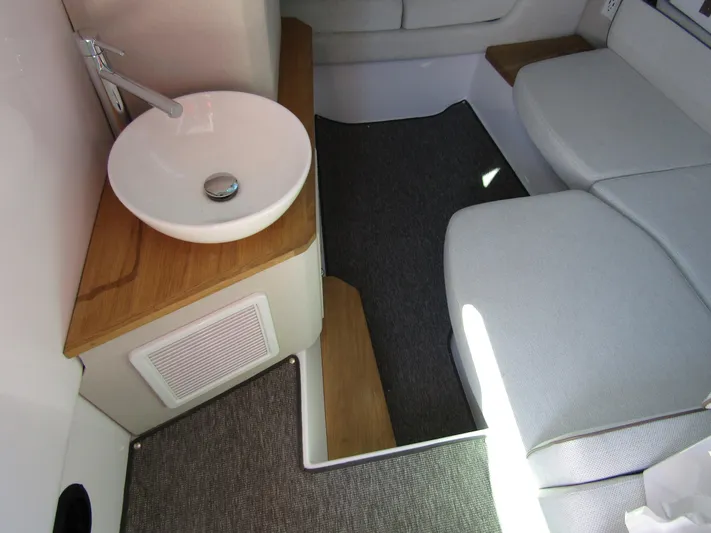 Empoleon Yacht Photos Pics Interior of 2025 Axopar 37XC CROSS CABIN BRABUS Trim with modern sink and seating.