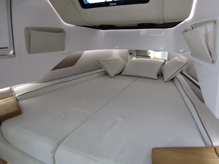 Empoleon Yacht Photos Pics Luxurious cabin interior of 2025 Axopar 37XC CROSS CABIN BRABUS Trim with comfortable bedding.