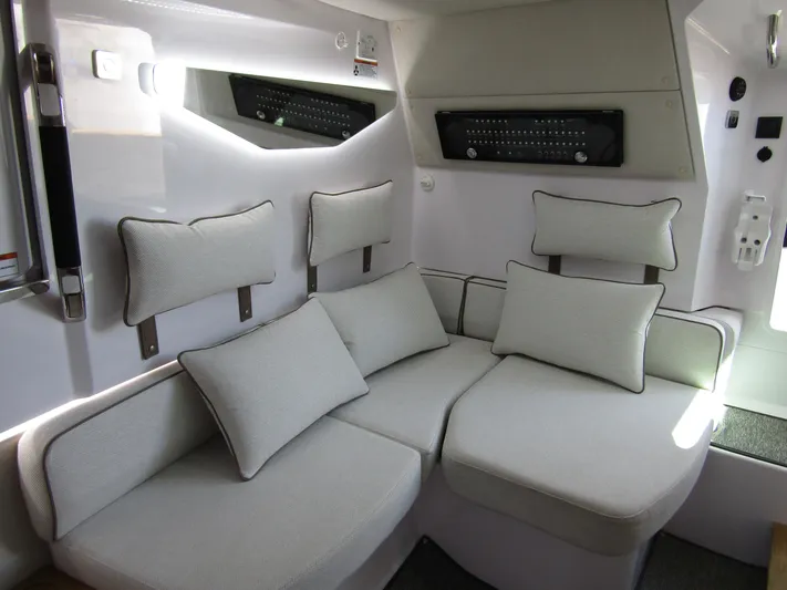 Empoleon Yacht Photos Pics Luxurious interior of 2025 Axopar 37XC CROSS CABIN BRABUS Trim with plush seating.