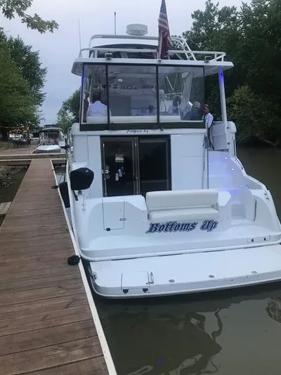 Bottoms Up Yacht Photos Pics 1996 Silverton 442 Cockpit Motor Yacht at dock.