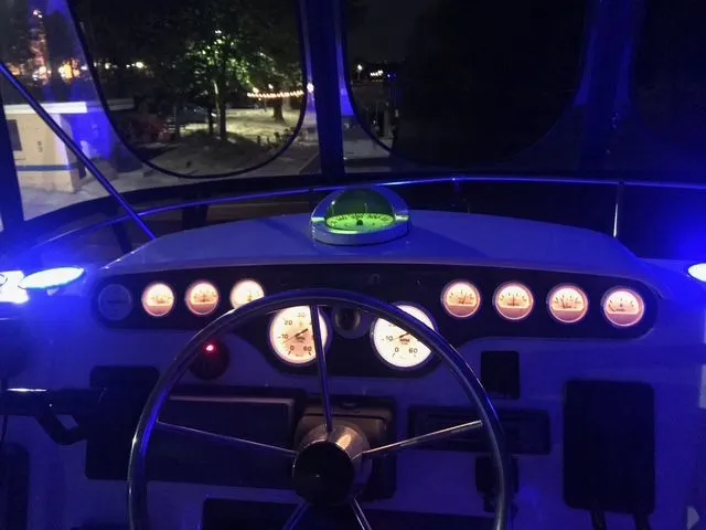 Bottoms Up Yacht Photos Pics Illuminated cockpit of a Silverton 442 yacht at night.