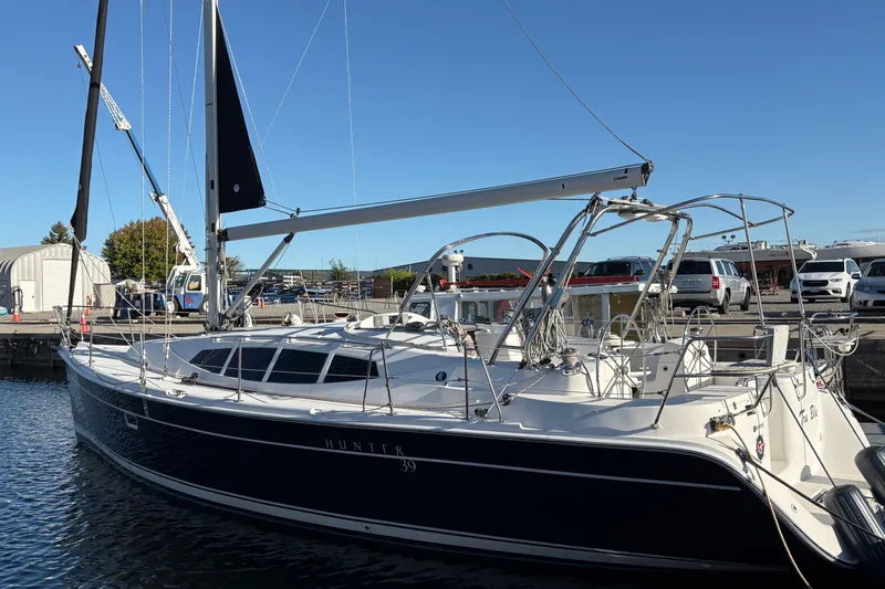 Tru Blu Yacht Photos Pics 2010 Hunter 39 sailboat docked at marina under clear blue sky.
