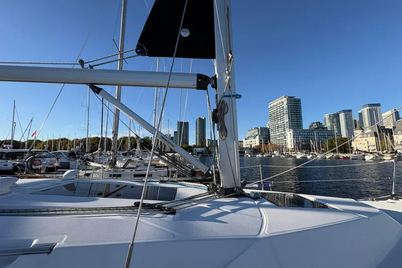 Tru Blu Yacht Photos Pics Sailboat Hunter 39 (2010) docked in urban marina with city skyline.