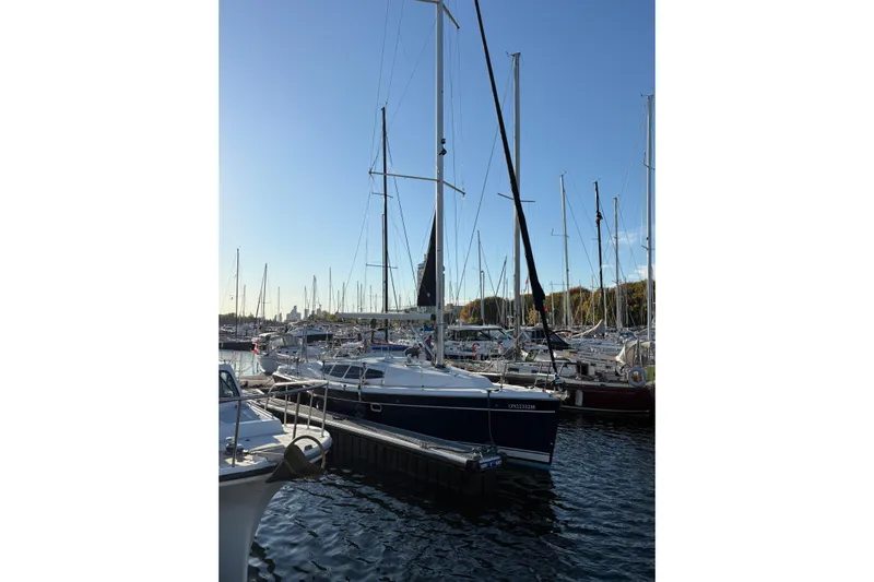 Tru Blu Yacht Photos Pics Sailboat docked in marina, Hunter 39 model, 2010, under clear blue sky.