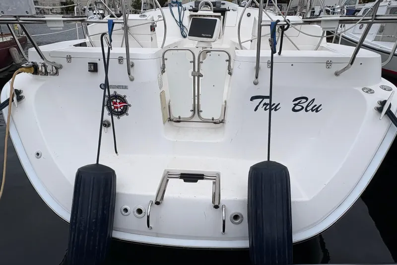 Tru Blu Yacht Photos Pics Rear view of 2010 Hunter 39 sailboat "Tru Blu" docked at marina.