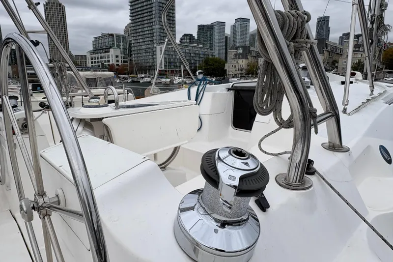 Tru Blu Yacht Photos Pics Sailboat deck of 2010 Hunter 39 with city skyline in background.