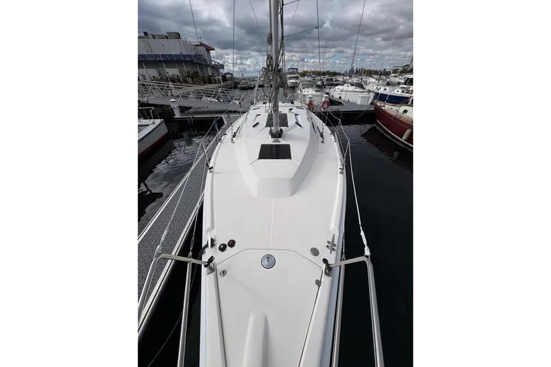 Tru Blu Yacht Photos Pics 2010 Hunter 39 sailboat docked at marina, overcast sky, surrounded by other boats.