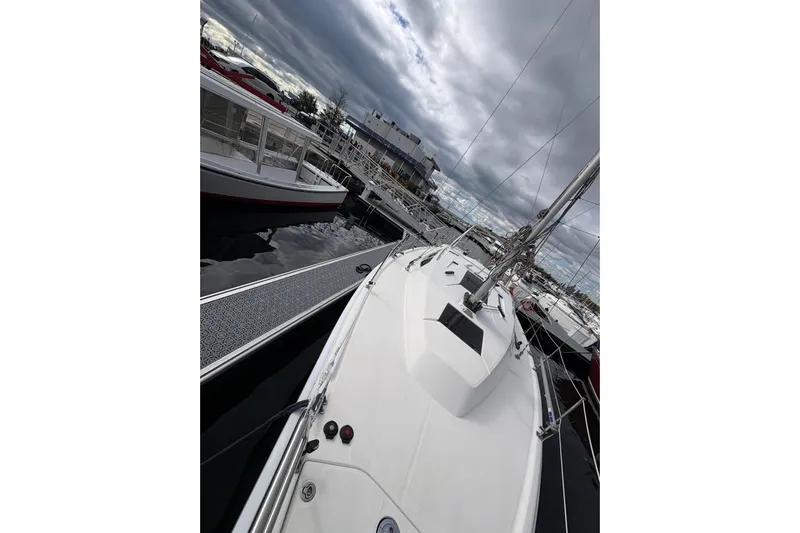 Tru Blu Yacht Photos Pics Sailboat docked at marina under cloudy sky, Hunter 39, 2010 model.
