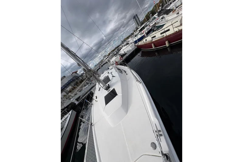 Tru Blu Yacht Photos Pics 2010 Hunter 39 sailboat docked at marina under cloudy skies.