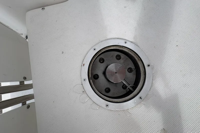 Tru Blu Yacht Photos Pics Deck fitting on a 2010 Hunter 39 sailboat, featuring a circular metal hatch.