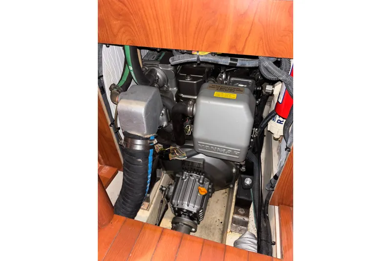 Tru Blu Yacht Photos Pics Engine compartment of a 2010 Hunter 39 sailboat, featuring a Yanmar engine.