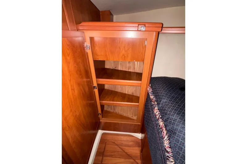 Tru Blu Yacht Photos Pics Wooden cabinet with open shelves in a 2010 Hunter 39 interior.