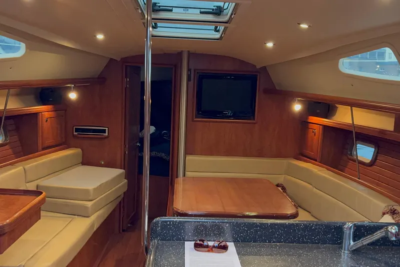 Tru Blu Yacht Photos Pics Luxurious interior of 2010 Hunter 39 yacht with wood finish and seating area.