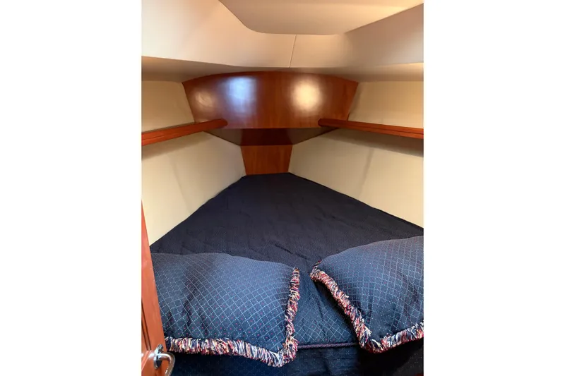 Tru Blu Yacht Photos Pics Cozy cabin interior of 2010 Hunter 39 sailboat with plush bedding.