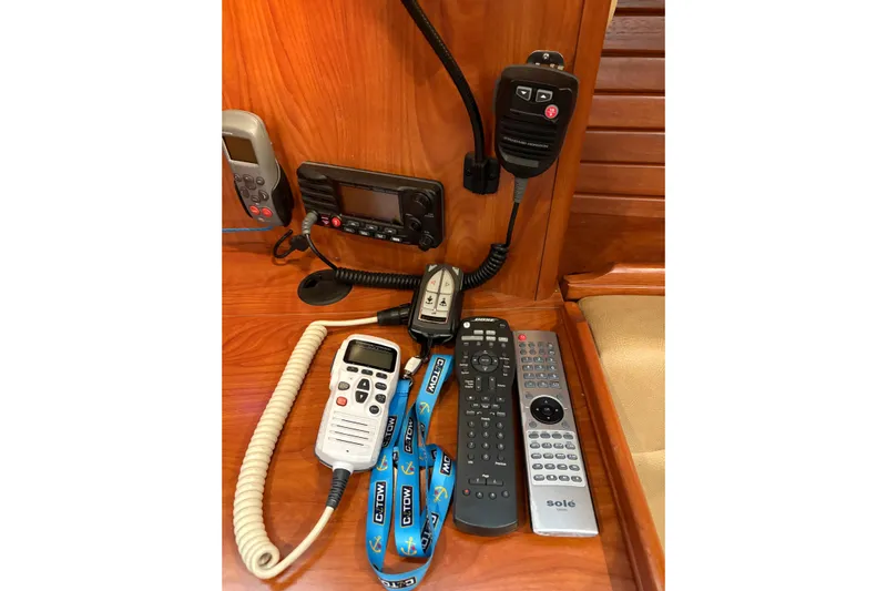 Tru Blu Yacht Photos Pics Communications and remote controls on a 2010 Hunter 39 yacht's wooden console.