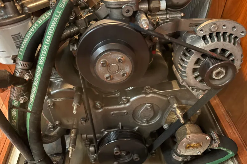 Tru Blu Yacht Photos Pics Engine components of a 2010 Hunter 39 sailboat, featuring belts and hoses.